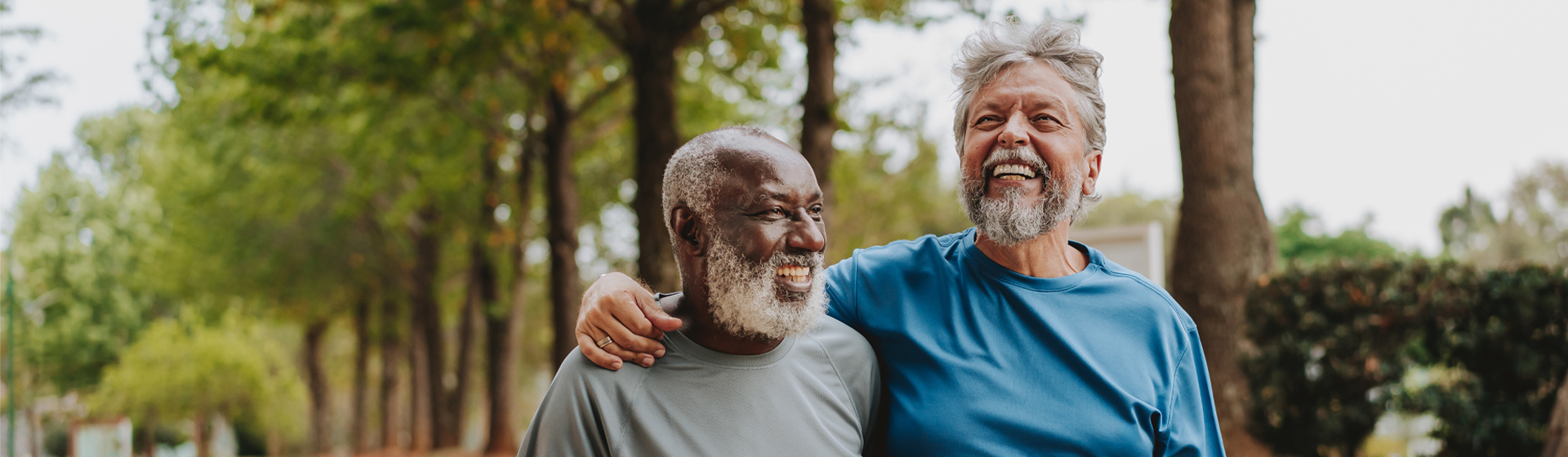 Two men smiling and walking together