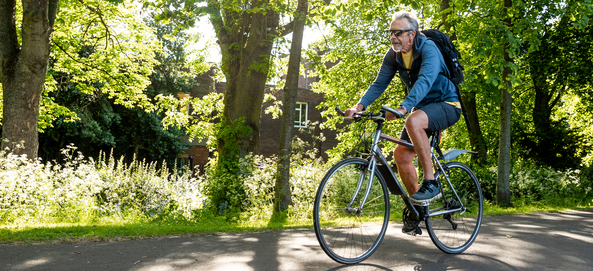 Man riding a bike in a park
