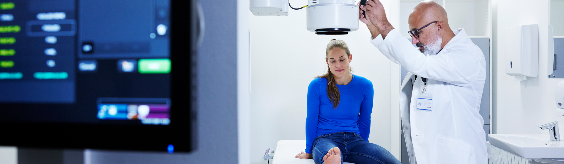 Doctor examining and making x-ray of patients foot