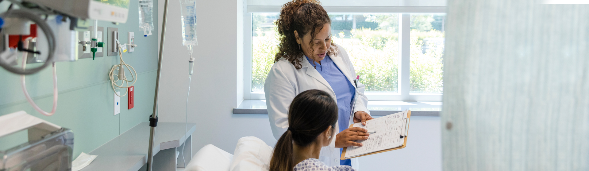 Female doctor shows her patient the medical test results