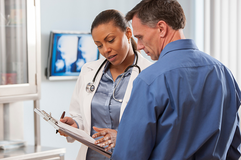 Man speaking to his doctor