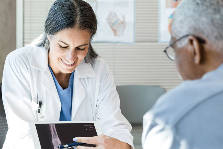 Doctor showing patient his scans
