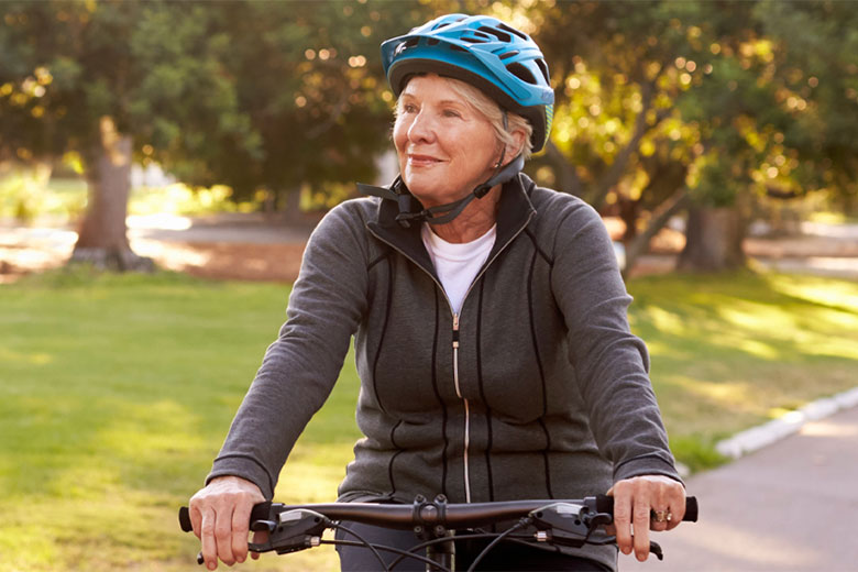 Woman riding a bike in a park