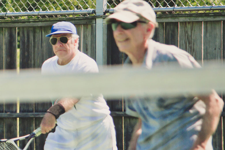 A couple playing tennis